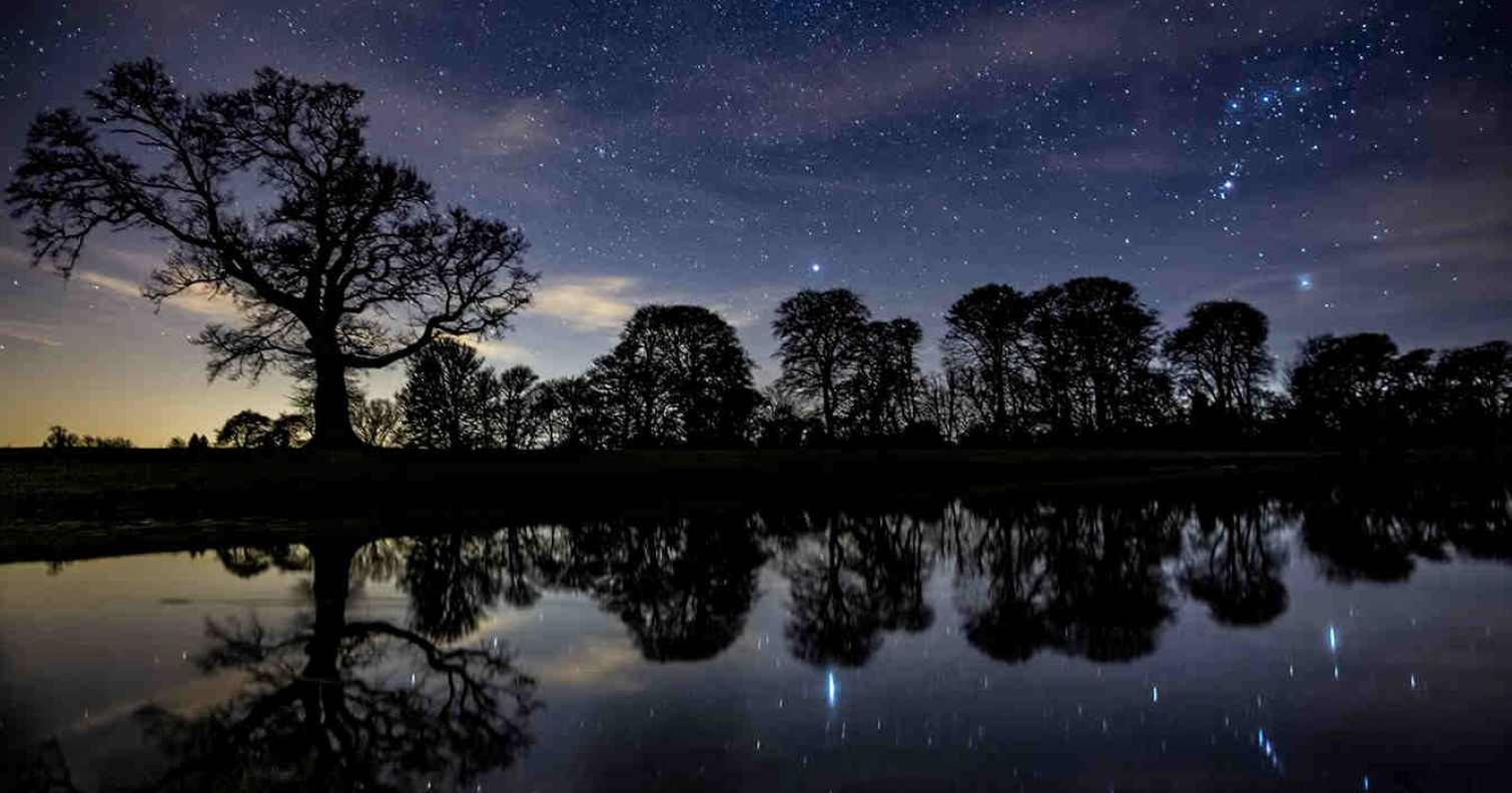 stargazing photo of the lake at Raby Castle with sky reflecting in water by Gary Lintern